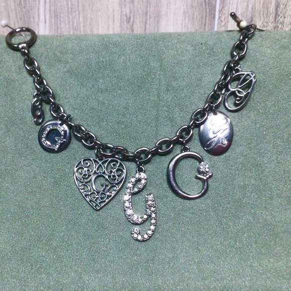 GUESS Silver Tone, Toggle Clasp, Multiple “G” Signature Charm Bracelet - Picture 1 of 4